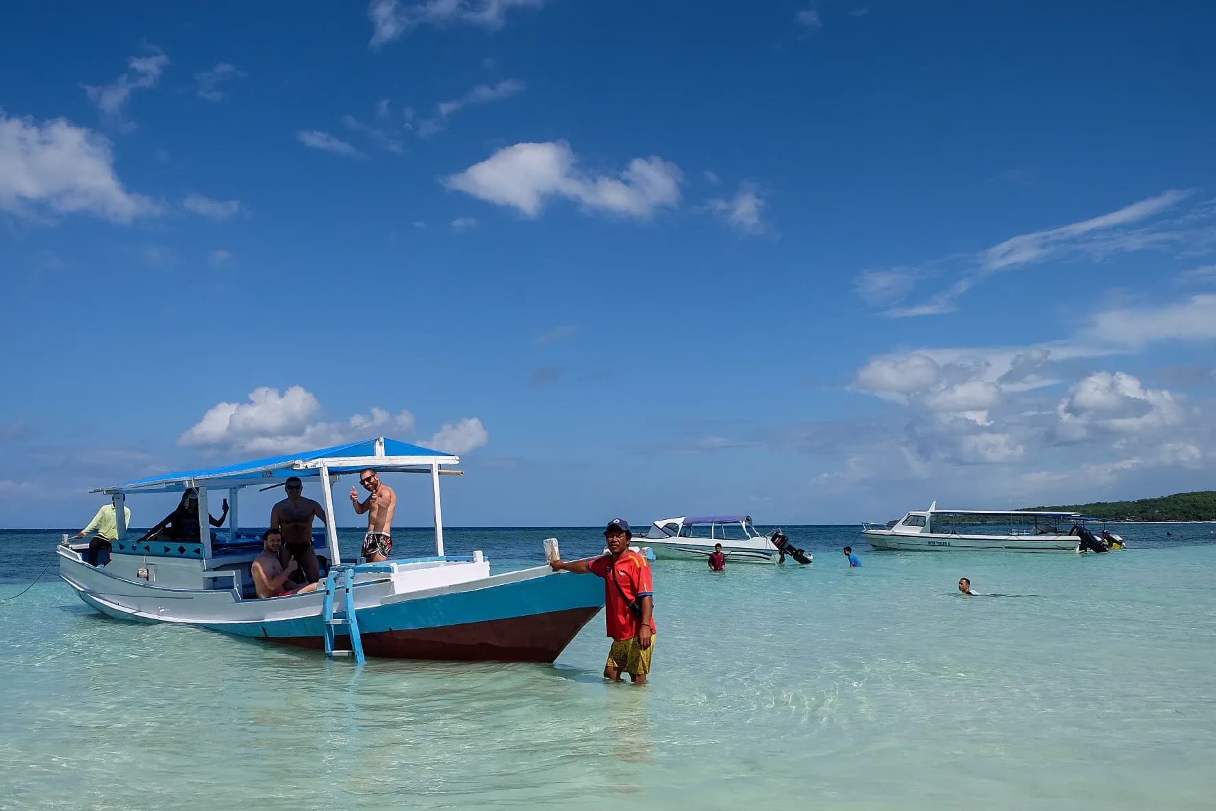Boat in clear water in the Togean Islands
