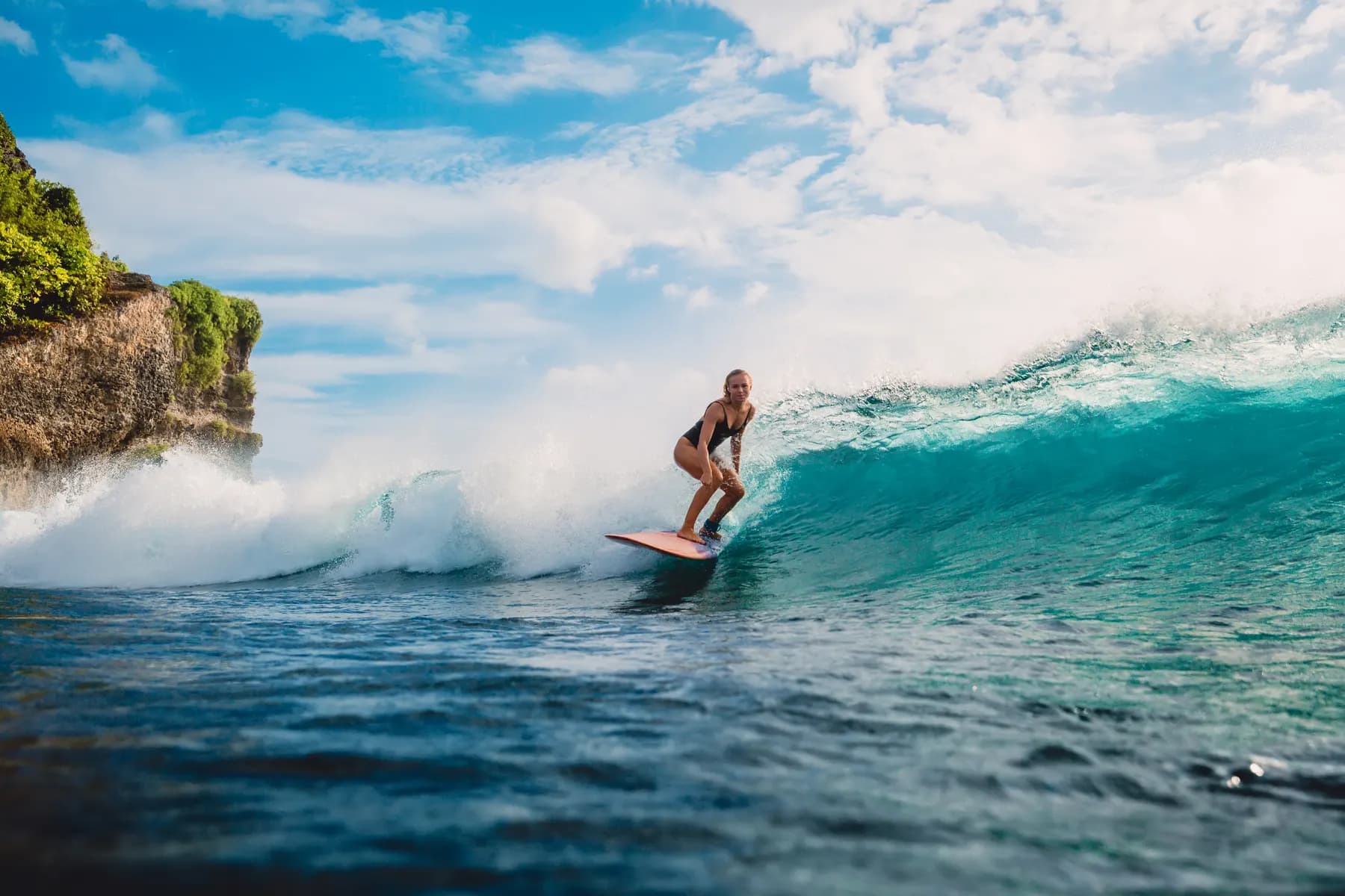 Surfer on a wave in Bali